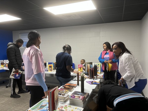 Community members at the MLK Youth Book Giveaway
